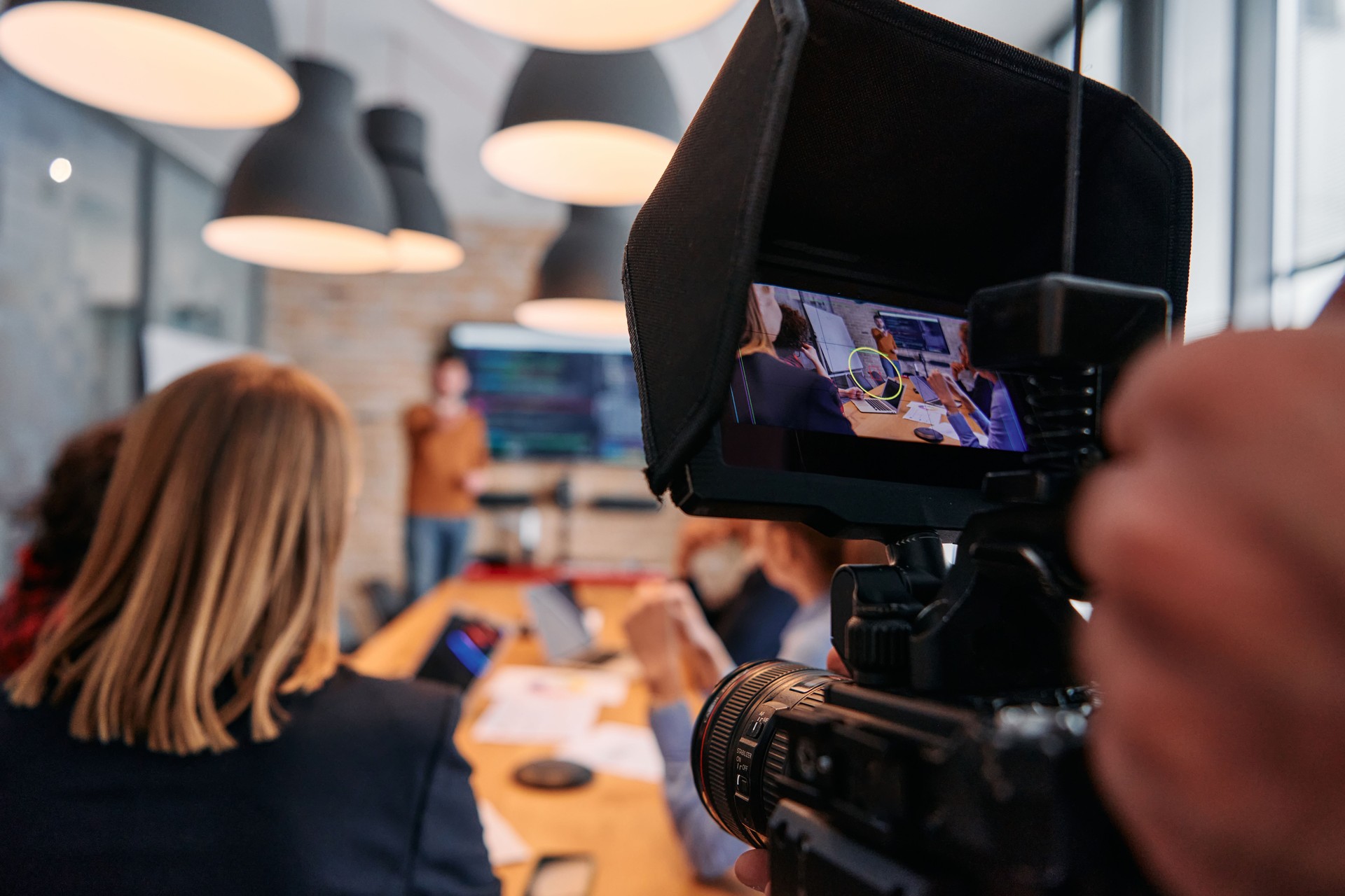 Capturing Corporate Dynamics: Videographer Films Business Meeting in Modern Office.
