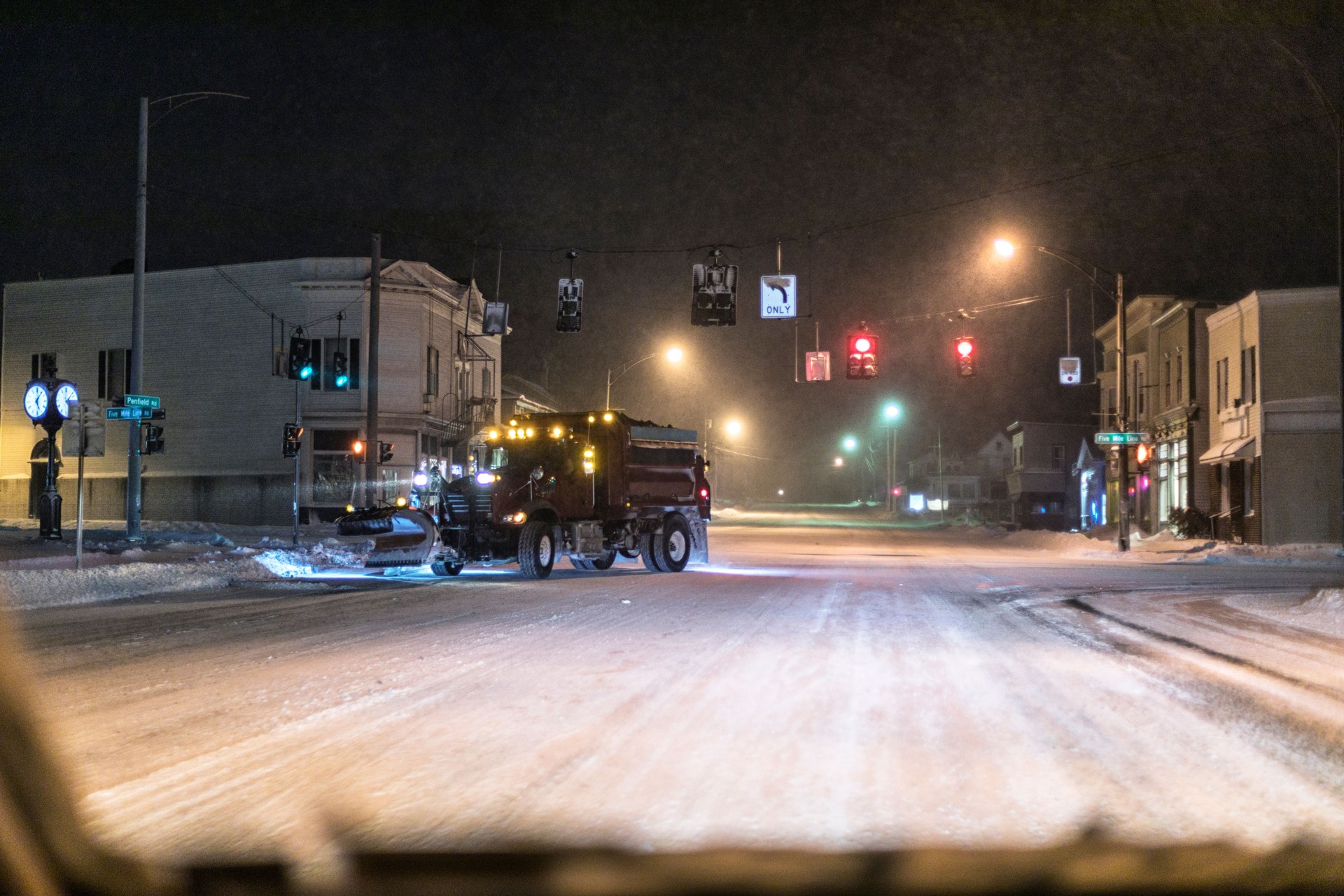 Night Snowplow Dump Truck Turning at Village Road Intersection